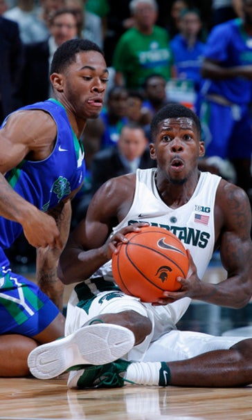 No. 13 Michigan St holds off FGCU 78-77 in disputed finish